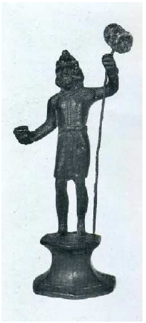 Fig. 5: Statue in bronze of Sucellus from Prémeaux, wearing typical Gaulish garments and holding the olla* and the long-shafted hammer in his hands. In the Musée de Beaune. Deyts, 1992, p. 85.