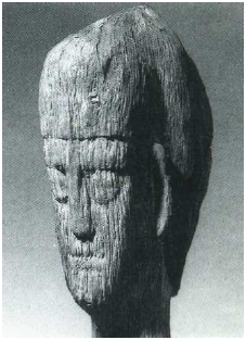 Fig. 54: Head in wood (wearing the Celtic torque*) from the spring of the Pré-Martin, in Luxeuil. In the Musée de Besançon (Doubs). Richard, 1991, p. 16, fig. 9.