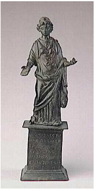 Fig. 17: Statuette in bronze of Rosmerta with inscription discovered in Champoulet. In the Musée des Antiquités Nationales de Saint-Germain-en-Laye. Joffroy, 1978, fig. 3.