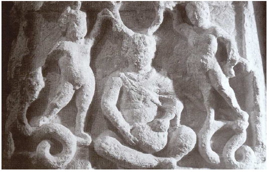 Fig. 41: Antlered god sitting cross-legged (Cernnunos?) surrounded by two naked children and snakes discovered in Vendoeuvres (Indre). Now in the Musée de Châteauroux. Lacroix, 2007, p. 213.